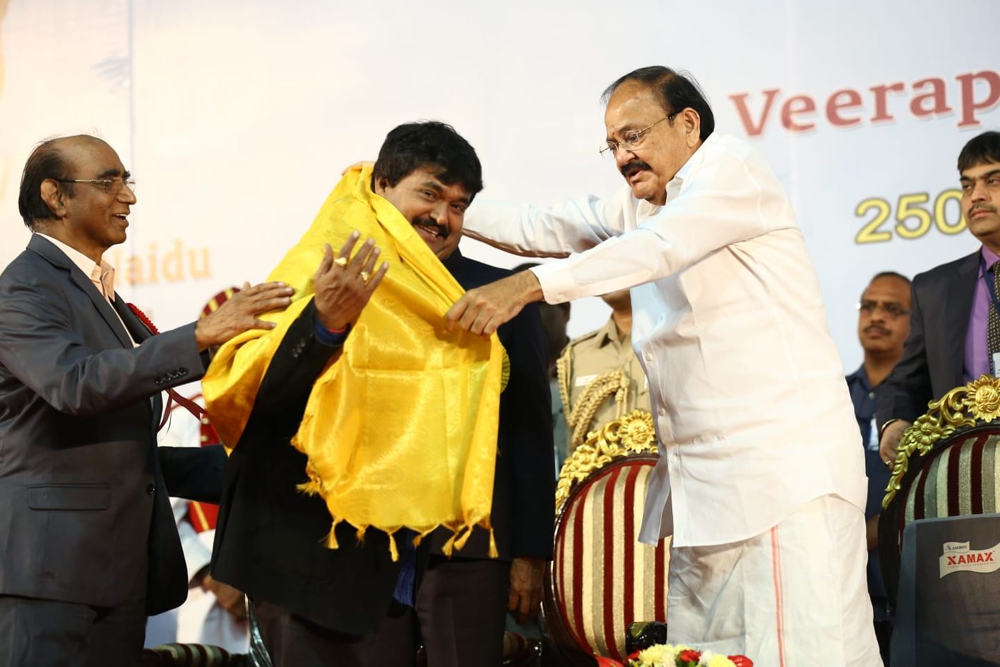 Ramu being honoured with a shawl on stage