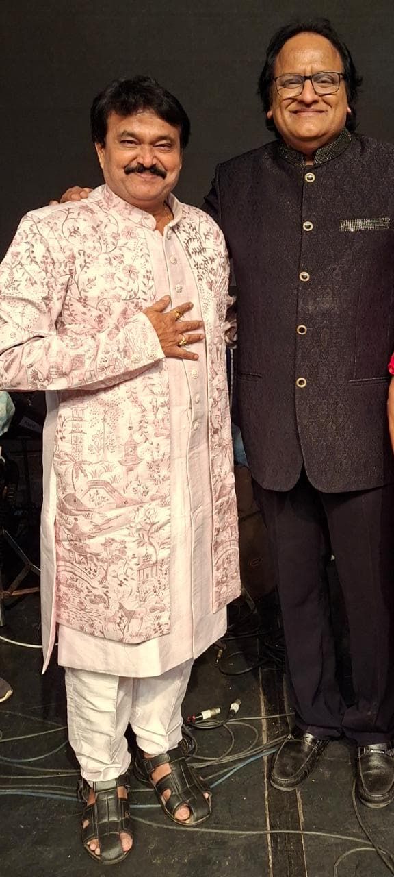 Ramu with a fellow artist backstage