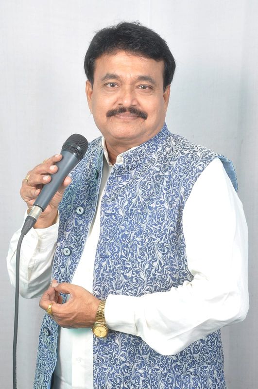 Ramu Maharajapuram, studio portrait, blue jacket