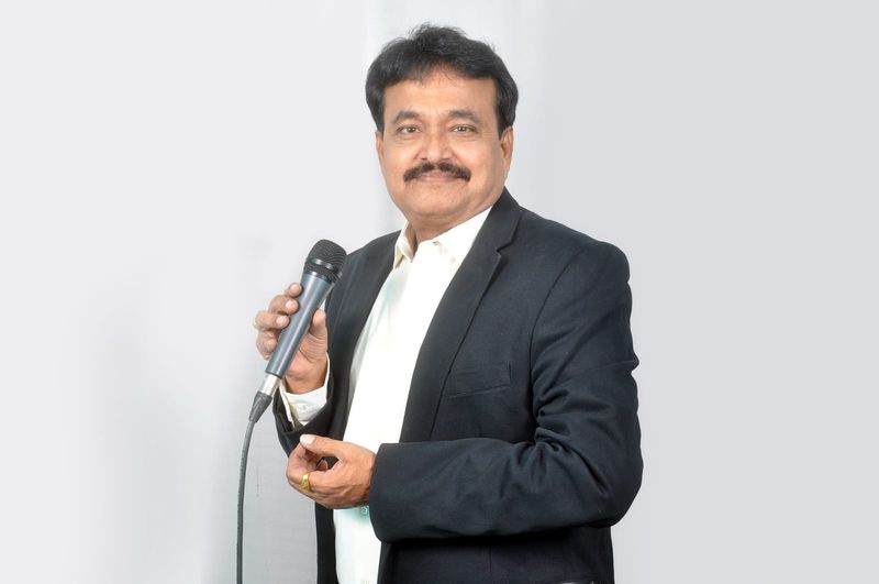Ramu Maharajapuram, studio portrait, black blazer