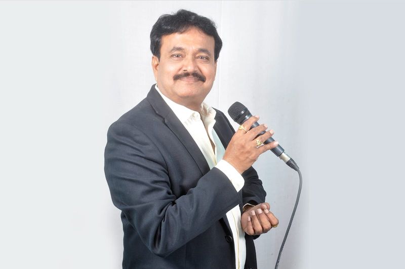 Ramu Maharajapuram, studio portrait, black blazer
