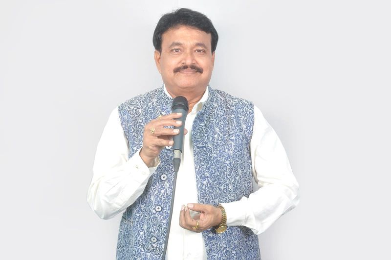 Ramu Maharajapuram, studio portrait, blue jacket, full length